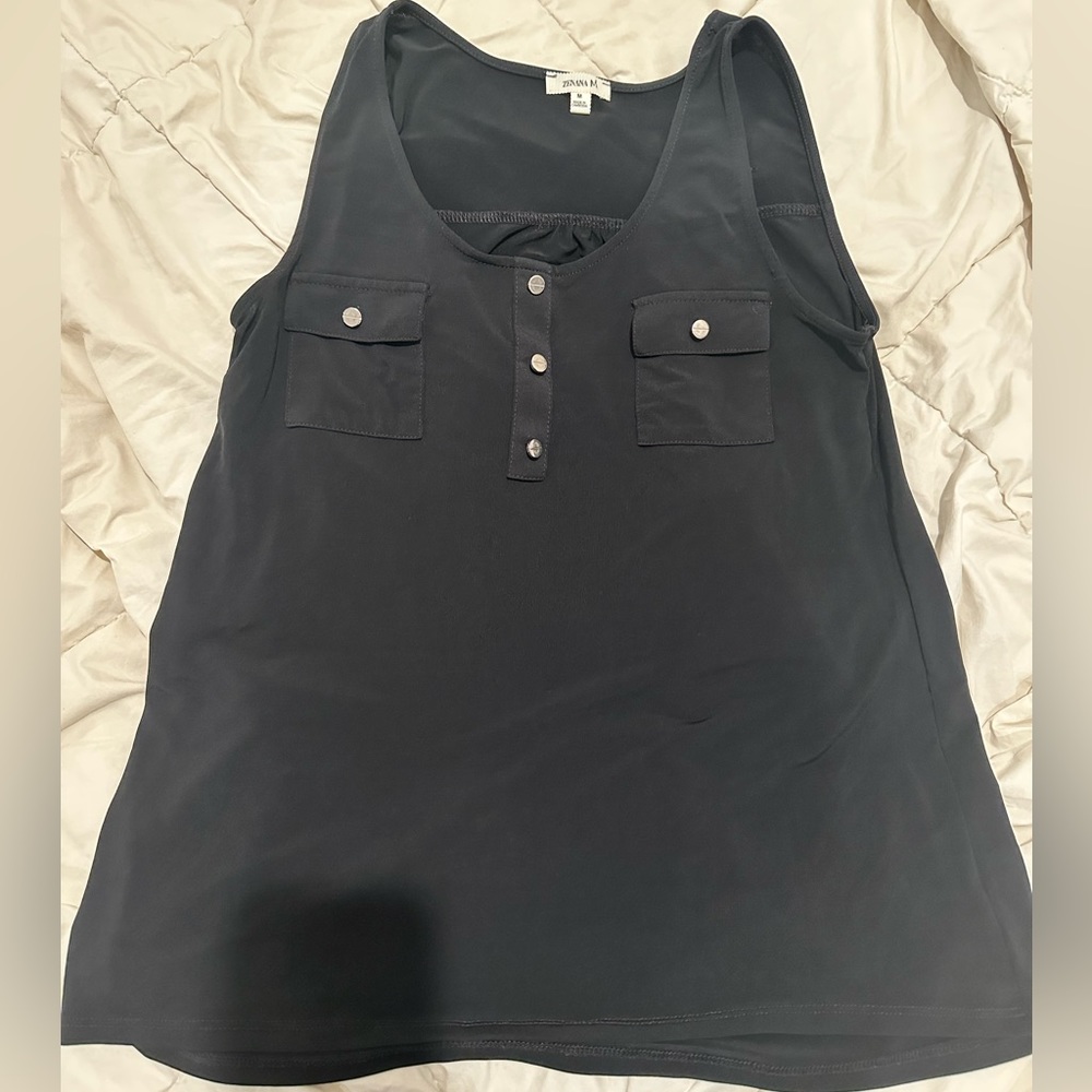 Black Tank. Front looks faded in the pic but it's not. No rips or stains.